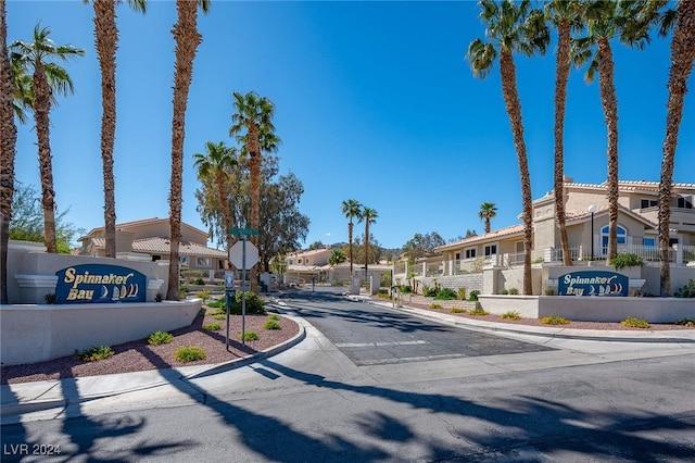 2259 Rugged Mesa Dr, Laughlin, NV 89029 - view of asphalt road featuring a residential view, traffic signs, curbs, and sidewalks