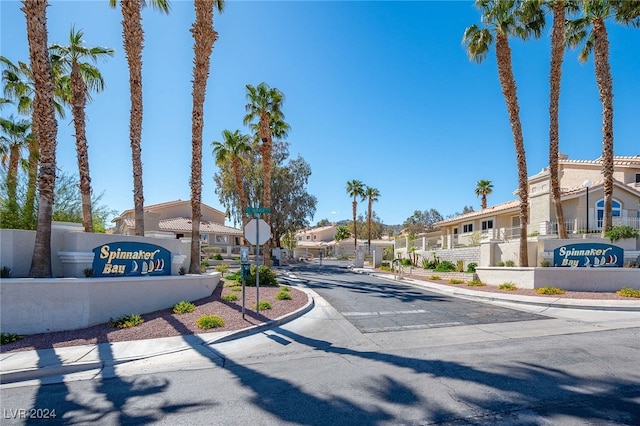 2259 Rugged Mesa Dr, Laughlin, NV 89029 - view of asphalt road with a residential view, traffic signs, sidewalks, and curbs