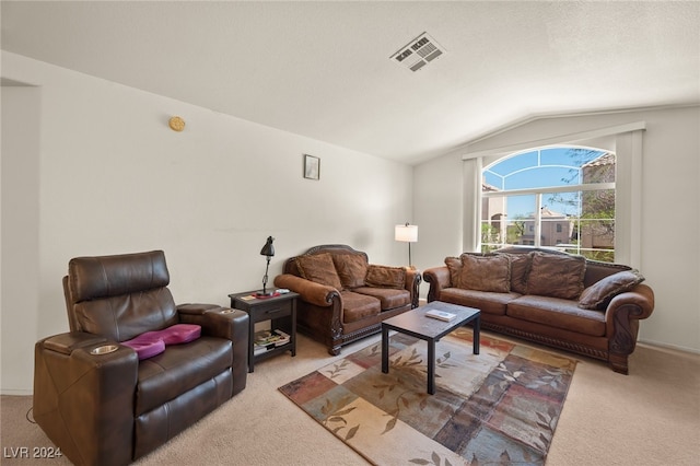 living room featuring lofted ceiling and light colored carpet