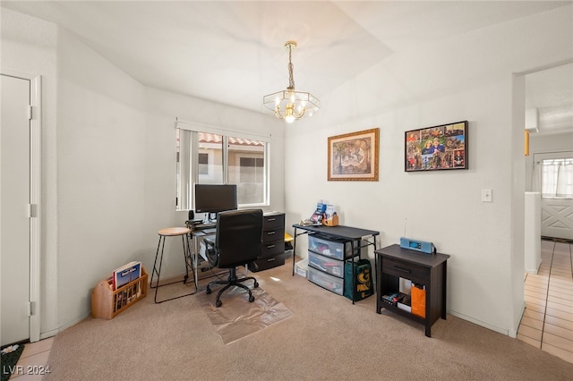 office with light tile patterned floors, a notable chandelier, lofted ceiling, and a wealth of natural light