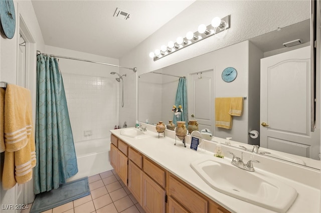 bathroom featuring vanity, shower / bath combination with curtain, and tile patterned flooring