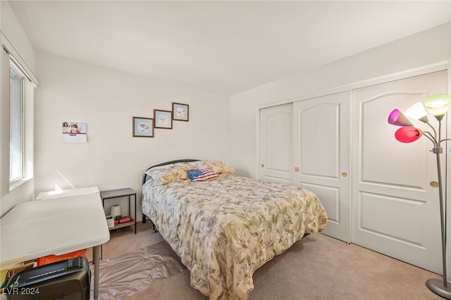 carpeted bedroom featuring a closet