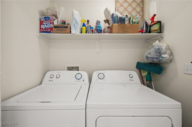 clothes washing area with washing machine and clothes dryer