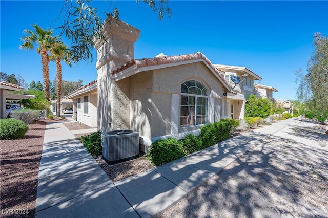 2259 Rugged Mesa Dr, Laughlin, NV 89029 - view of side of property with stucco siding and a tile roof