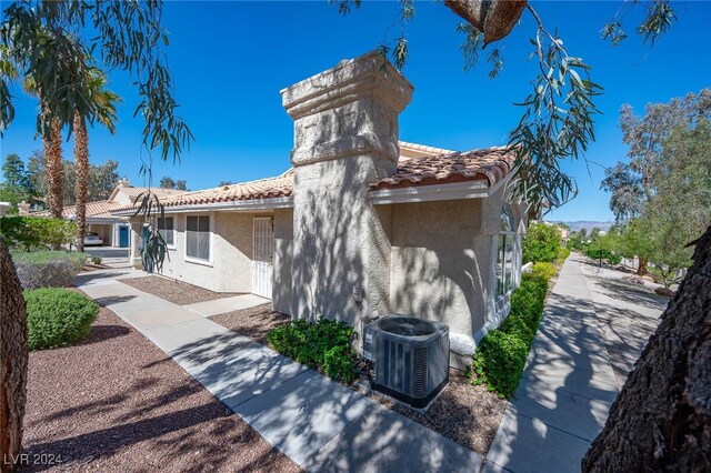 2259 Rugged Mesa Dr, Laughlin, NV 89029 - view of side of property featuring a tile roof and stucco siding