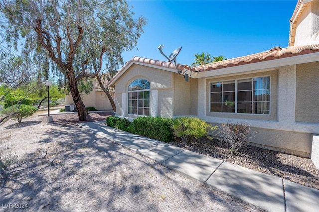 2259 Rugged Mesa Dr, Laughlin, NV 89029 - view of property exterior featuring stucco siding and a tiled roof