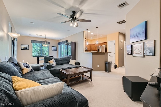 living room with light carpet, visible vents, and recessed lighting