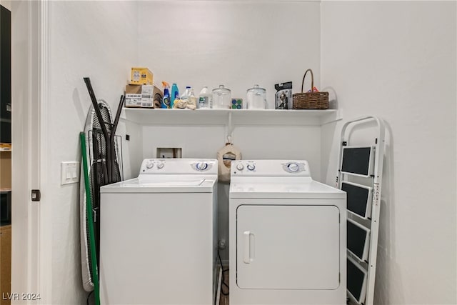 laundry room with laundry area and washing machine and clothes dryer