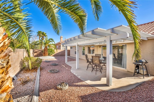 view of patio / terrace with a pergola and area for grilling