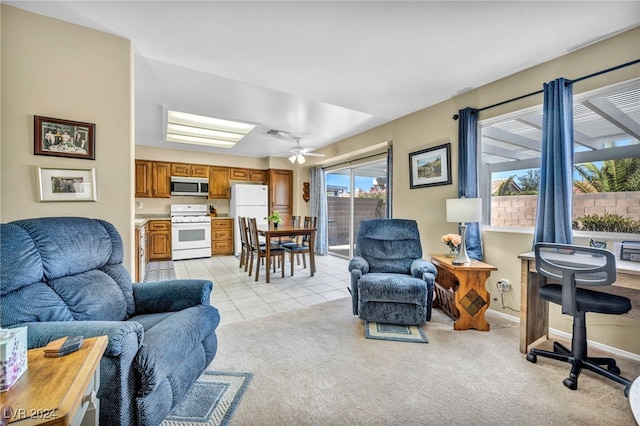 carpeted living room featuring ceiling fan