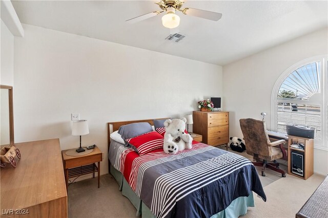 bedroom with ceiling fan and light colored carpet