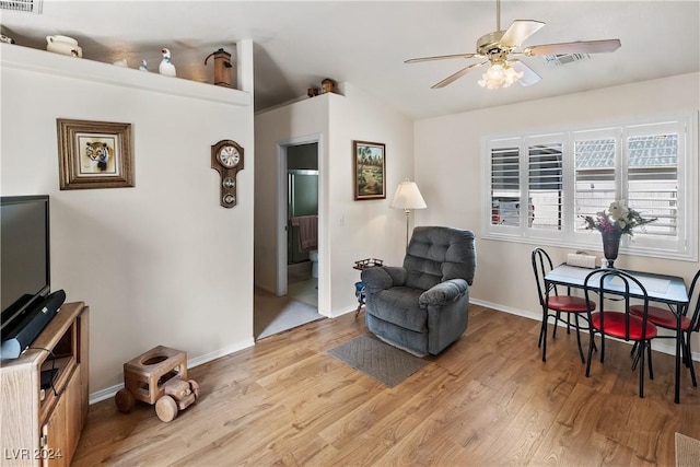 living area featuring ceiling fan and light hardwood / wood-style flooring