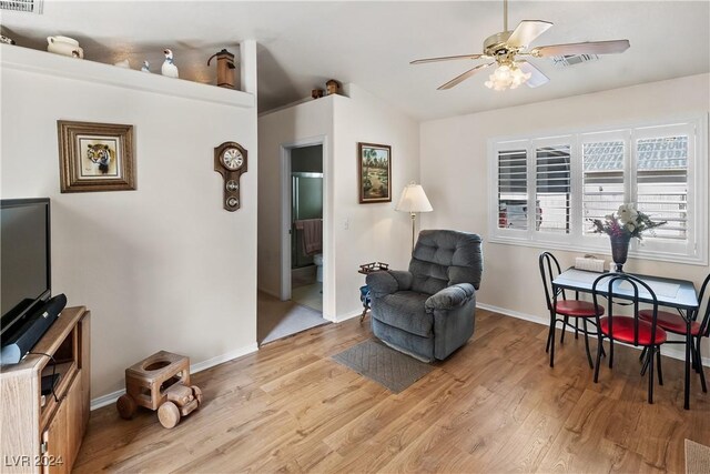 sitting room featuring ceiling fan and light wood-type flooring