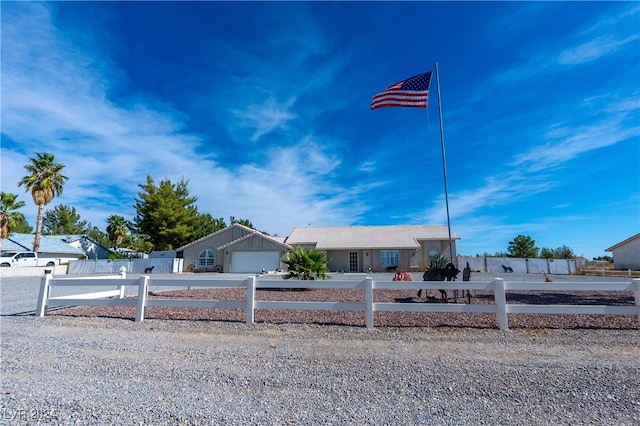 ranch-style house featuring a garage