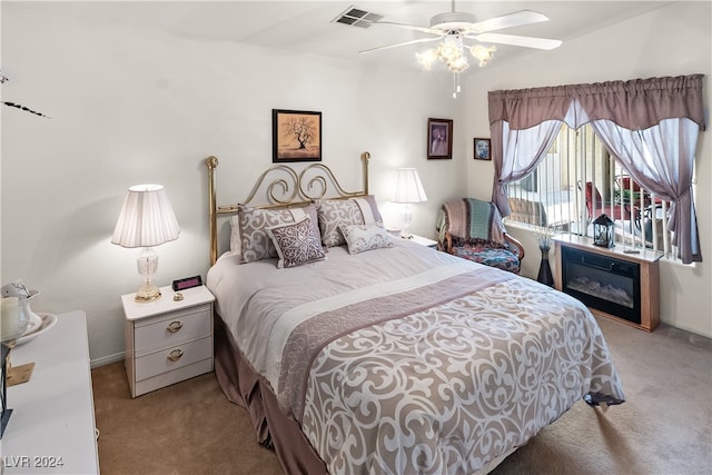 bedroom featuring ceiling fan and light colored carpet