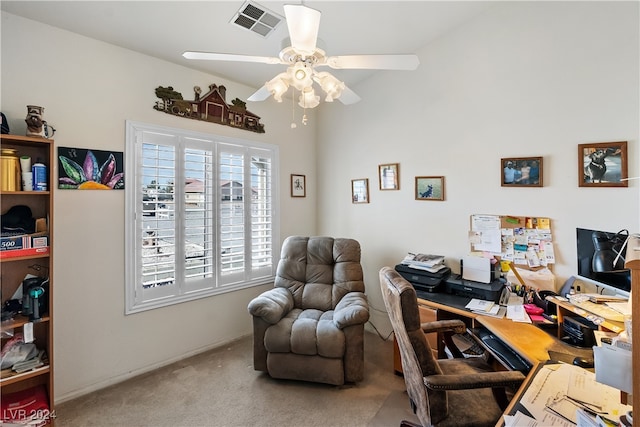 carpeted home office with ceiling fan