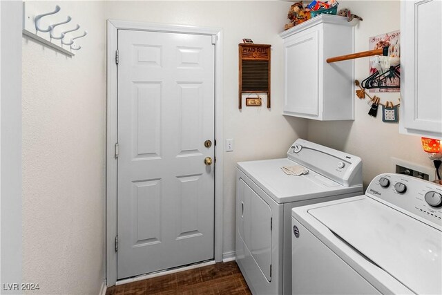 washroom featuring separate washer and dryer, dark hardwood / wood-style flooring, and cabinets