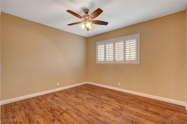 empty room featuring hardwood / wood-style floors and ceiling fan