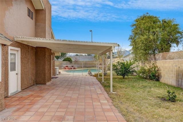 view of patio / terrace featuring a fenced in pool