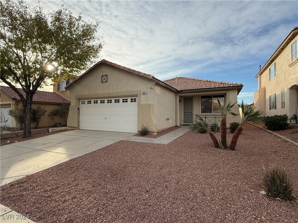 view of front of property with a garage