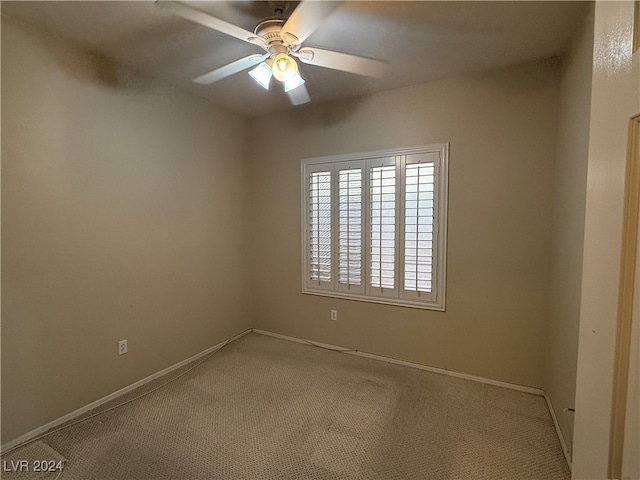 empty room with carpet floors and ceiling fan