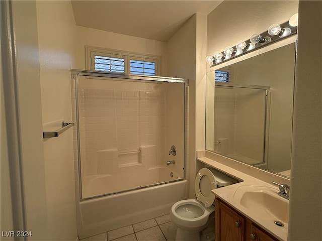 full bathroom featuring vanity, toilet, tile patterned floors, and shower / bath combination with glass door