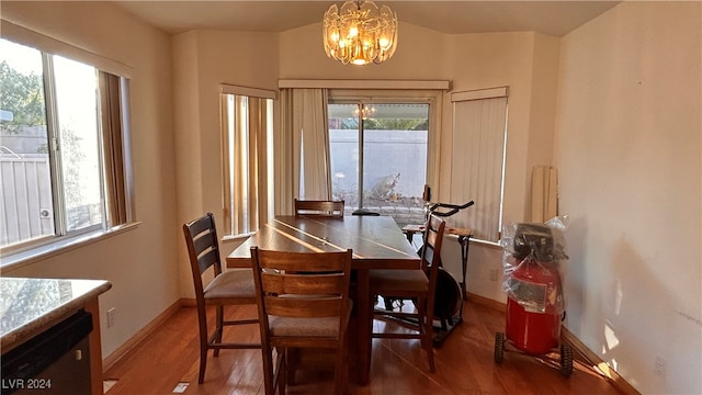 dining room with a chandelier and hardwood / wood-style flooring