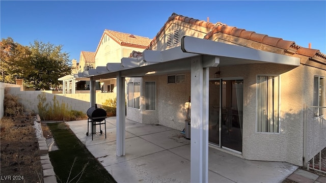 rear view of property featuring a patio