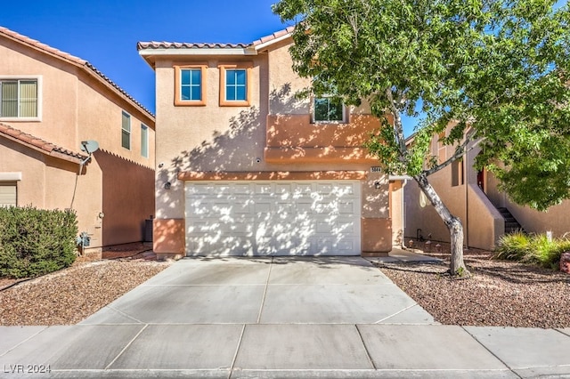 view of front of property with a garage