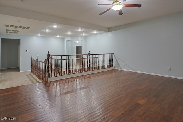 spare room with wood-type flooring and ceiling fan