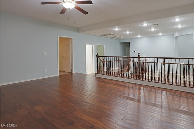 unfurnished room with hardwood / wood-style floors and ceiling fan