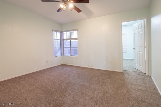 spare room featuring carpet floors and ceiling fan