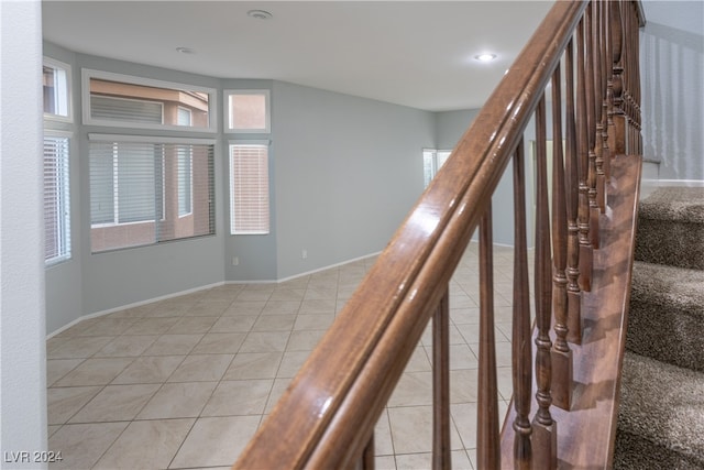 staircase featuring tile patterned floors