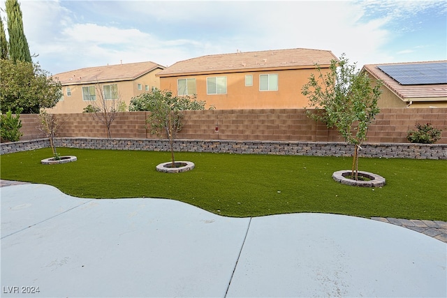 view of yard featuring a patio and an outdoor fire pit