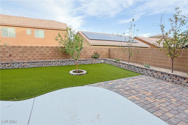 view of yard with a patio and an outdoor fire pit