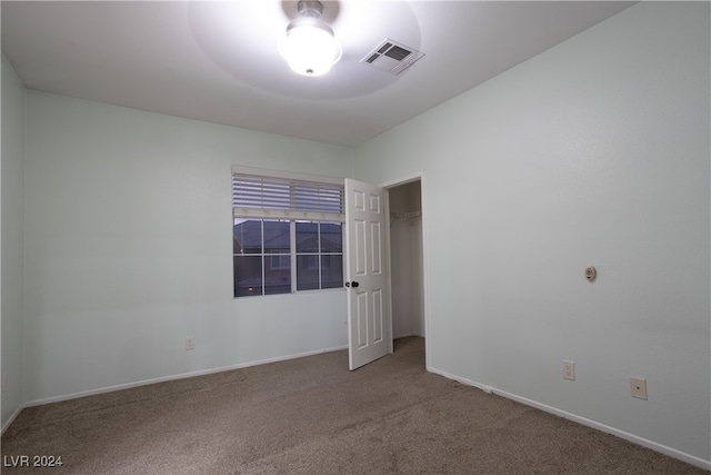 unfurnished room with carpet flooring