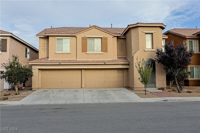 front of property with a garage