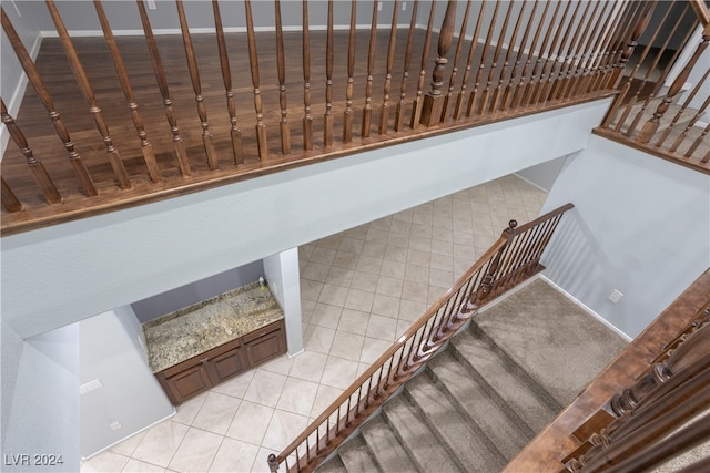 staircase with tile patterned floors