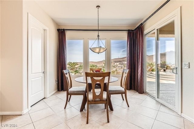 tiled dining area with a mountain view