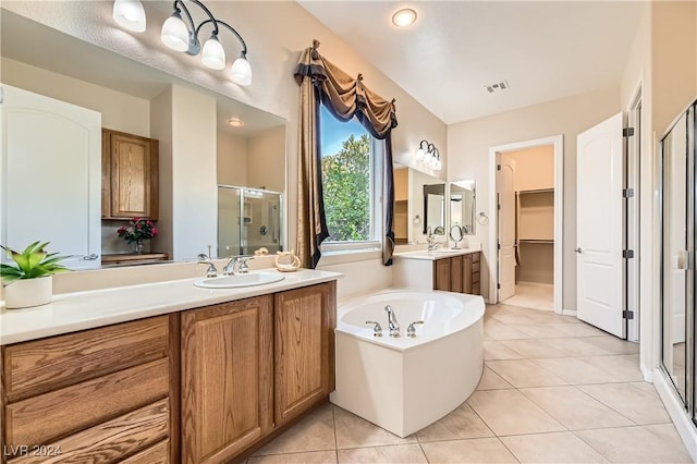 bathroom with tile patterned flooring, vanity, and independent shower and bath