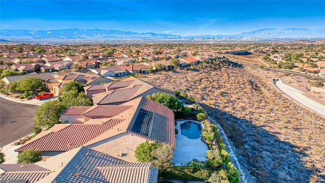 birds eye view of property with a mountain view