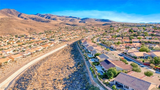 birds eye view of property with a mountain view