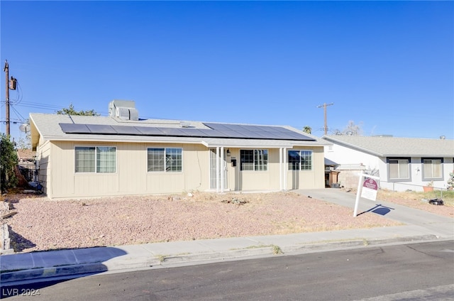 view of front of house with solar panels