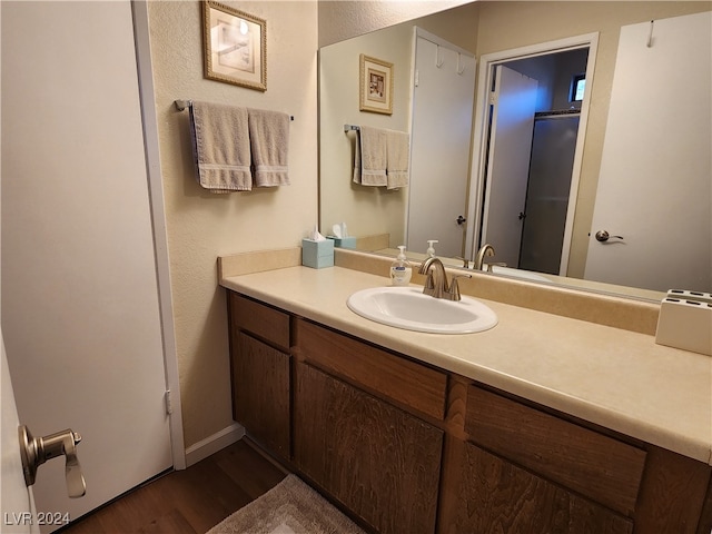 bathroom featuring vanity and hardwood / wood-style flooring