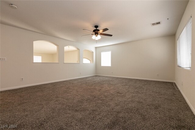 carpeted empty room with ceiling fan