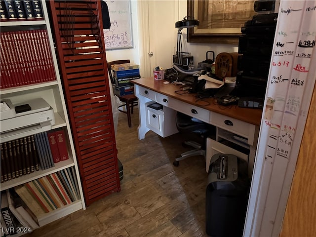 office with dark wood-type flooring