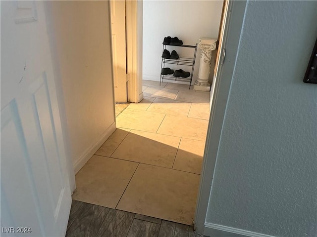 hallway with light tile patterned flooring