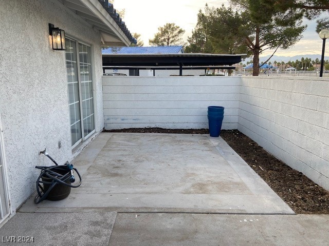 view of patio terrace at dusk