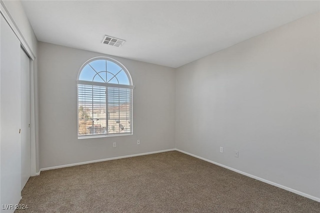 view of carpeted spare room