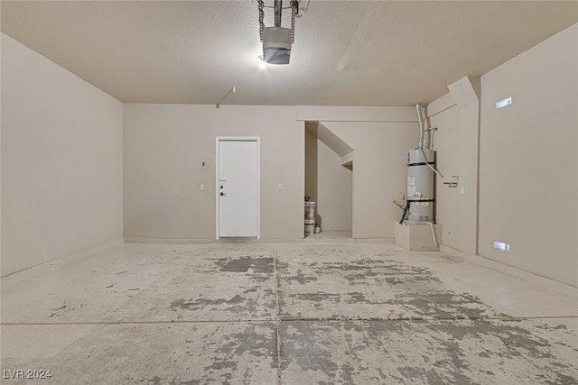 garage with a garage door opener and strapped water heater